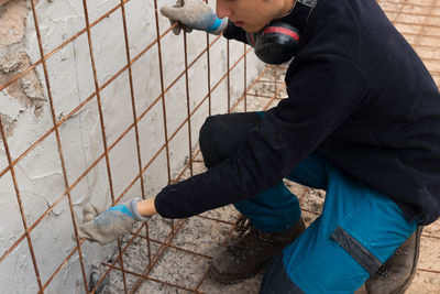 Low section of man working at construction site