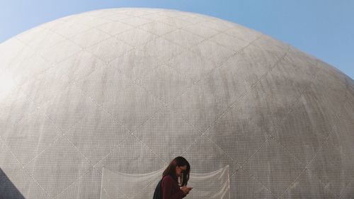 Portrait of woman against sky