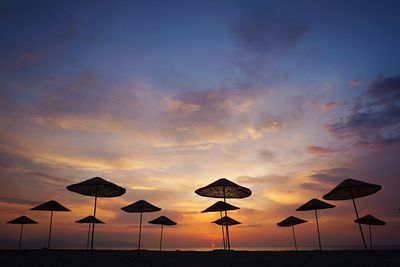 Scenic view of beach against sky during sunset