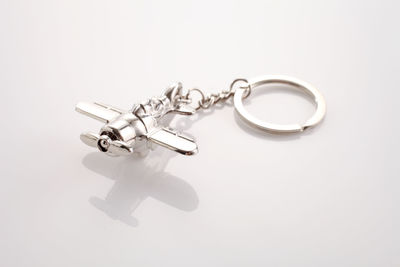 High angle view of airplane key chair on white background