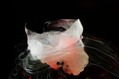 Close-up of ice cream over black background