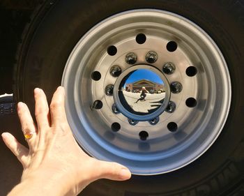 Close-up of human hand holding mirror