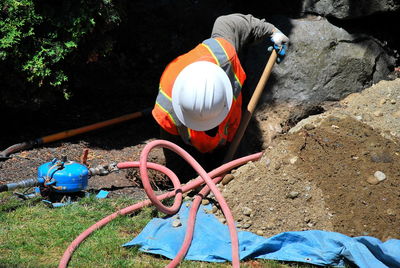 High angle view of people working on rock