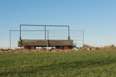 Built structure on field against clear sky