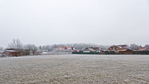 Scenic view of frozen lake against sky during winter
