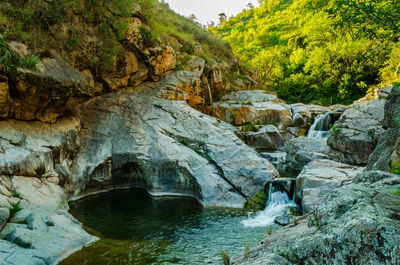 Stream flowing through rocks in river