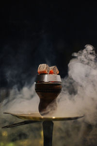 Close-up of smoke stack on barbecue grill