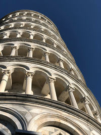 Low angle view of historical building against blue sky