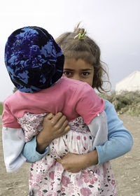 Rear view of mother with girl