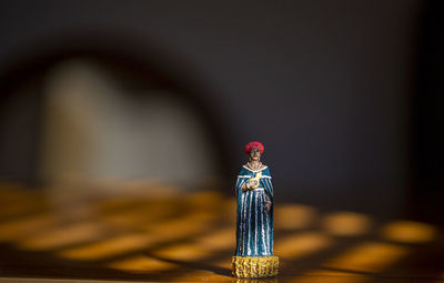Close-up of small statue on table