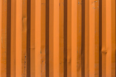 Full frame shot of orange corrugated metal wall