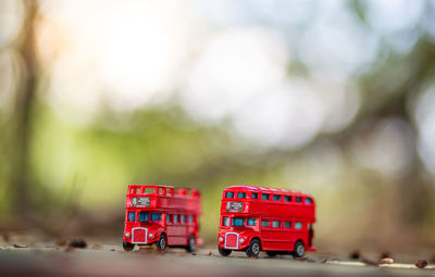 Close-up of red toy car on table