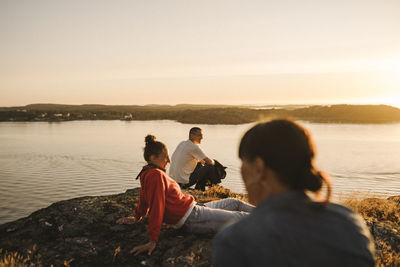 Friends relaxing at sea