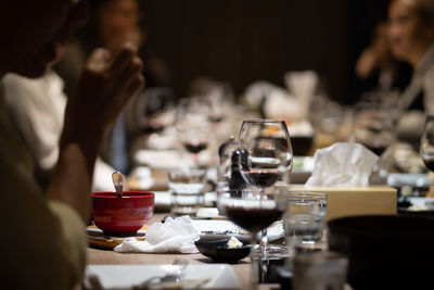 Close-up of wine glasses on table