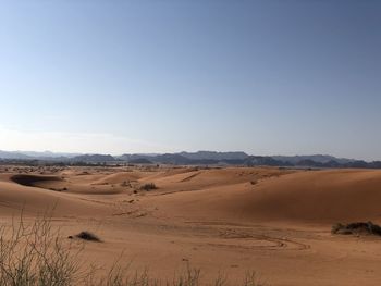 Scenic view of desert against clear sky