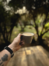 Close-up of hand holding coffee