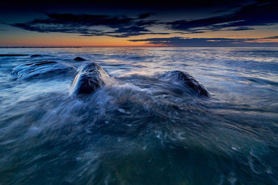 View of sea against sky at sunset