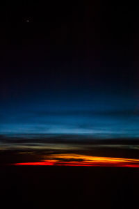 Scenic view of sea against sky at night