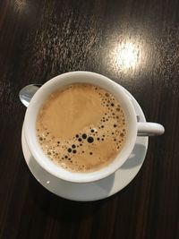 High angle view of coffee cup on table