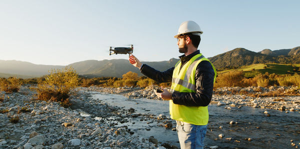 Geologist with drone check the state of the environment