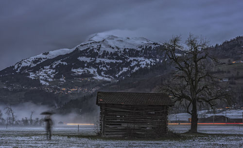 Scenic view of snow covered mountain against sky