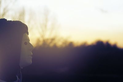 Close-up of man at sunset