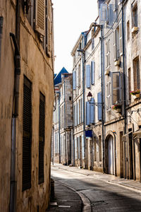 Scenic view of narrow street in the historic centre of la rochelle, france