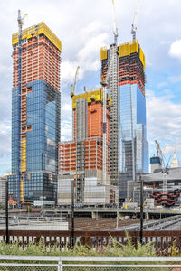 Modern buildings in city against sky