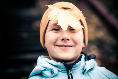 Close-up portrait of smiling boy