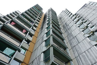 Low angle view of modern buildings against clear sky