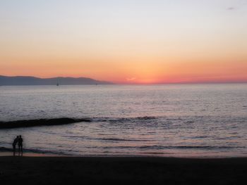 Scenic view of sea at sunset