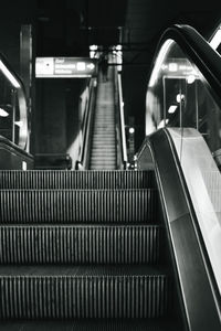 Vertical grayscale shot of metro escalator stairs - great for wallpapers