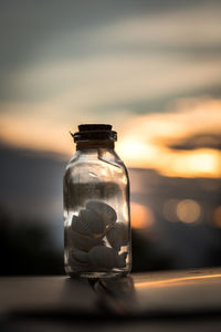 Close-up of glass jar on table