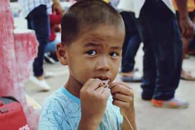 Close-up of innocent boy looking away