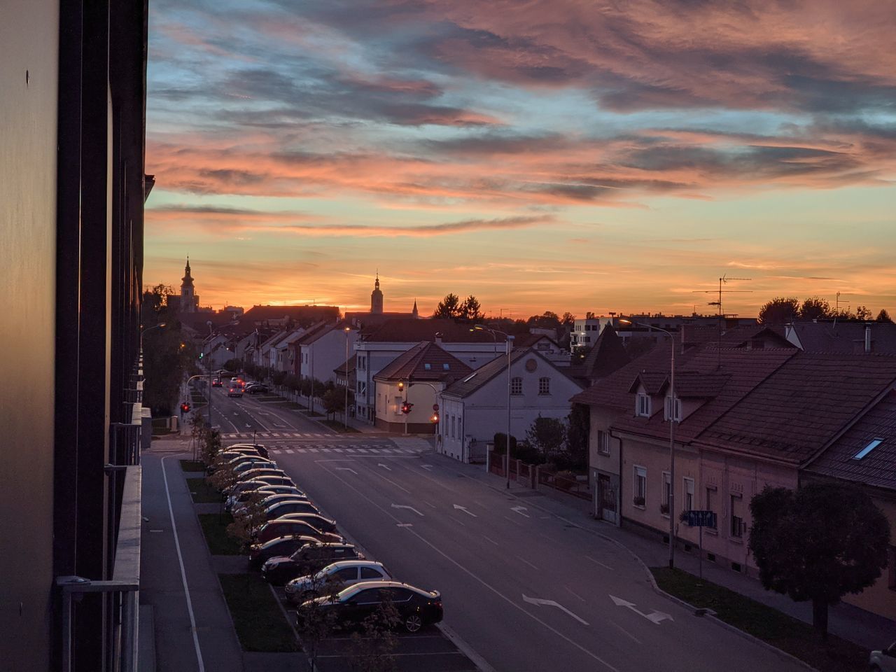 HIGH ANGLE VIEW OF CITY STREET AND BUILDINGS AGAINST SKY