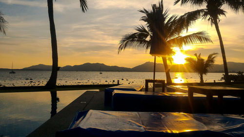 Scenic view of swimming pool against sky during sunset