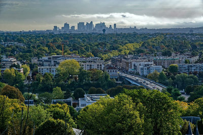 High angle view of trees and buildings in city