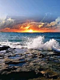 Scenic view of sea against sky during sunset