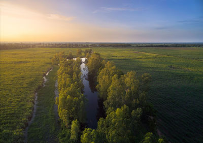 Scenic view of land against sky during sunset