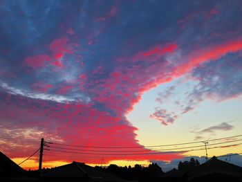 Low angle view of dramatic sky during sunset