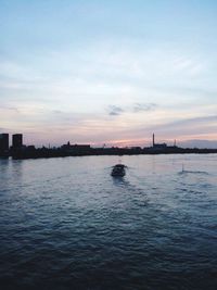 Scenic view of river against sky during sunset