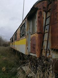 Abandoned train against sky