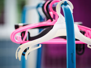 Close-up of multi colored pencils hanging on rack