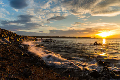 Scenic view of sea against sky during sunset