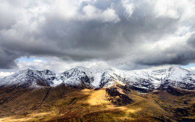 Scenic view of snowcapped mountains against sky