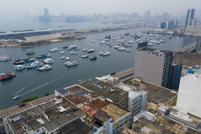 High angle view of buildings by sea