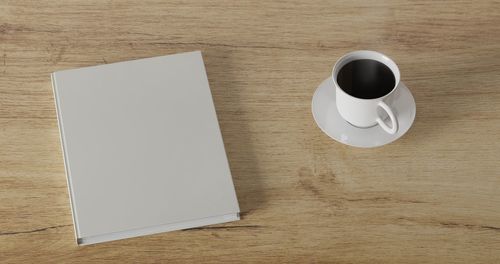 High angle view of coffee cup on table