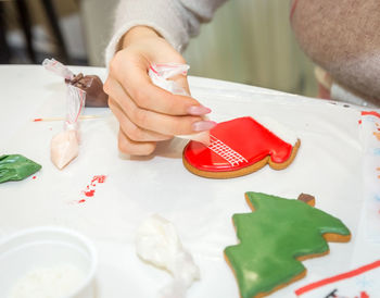 High angle view of woman preparing food on table