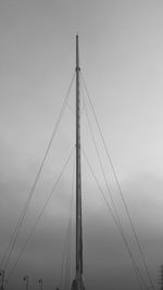 Low angle view of suspension bridge against sky