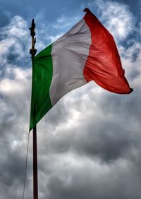 Low angle view of flag against sky